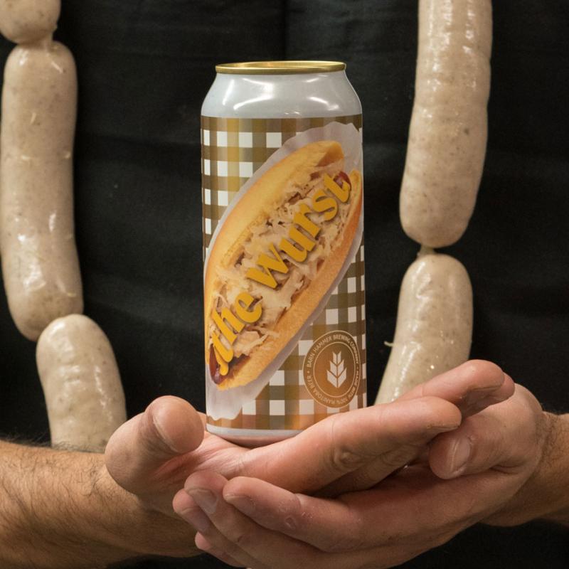 can of wurst in hands and bratwursts