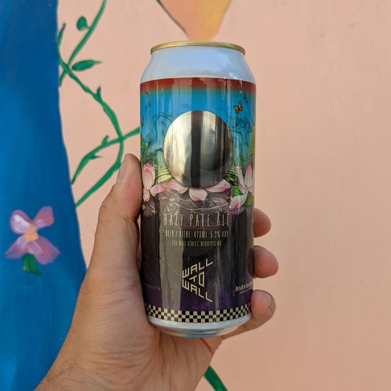 can in front of colourful mural